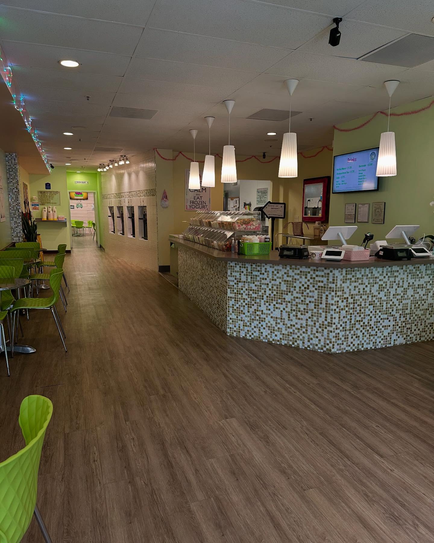 Inside 1st Treat Yogurt — self-serve froyo machines, toppings bar, and seating in downtown Livermore